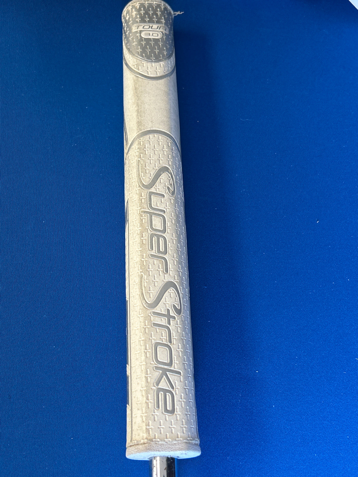 White Hot Pro #1 blade putter with the original White Hot insert and a SuperStroke grip.